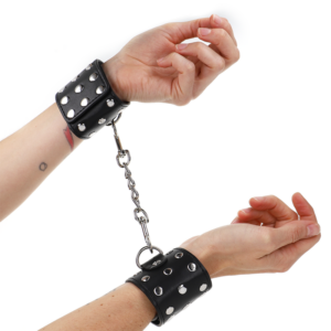 WRIST RESTRAINTS WITH SNAP FASTEN FULL OF RIVETS BLACK ADJUSTABLE 19-24 CM X 5.5 CM
